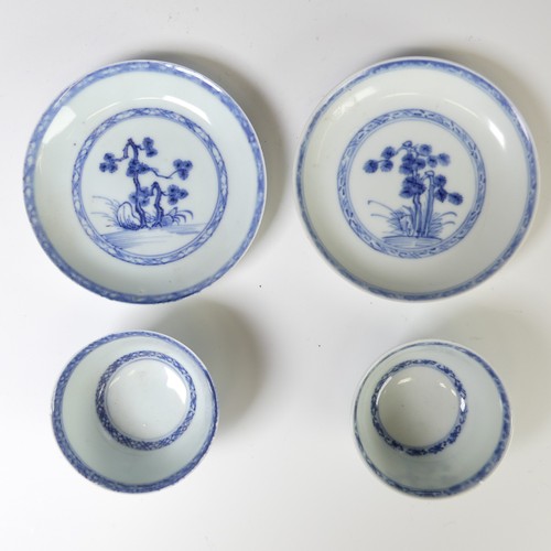 238 - A Nanking cargo type Tea Bowl and Saucer,  together with another Tea Bowl and Saucer, decorated in t... 