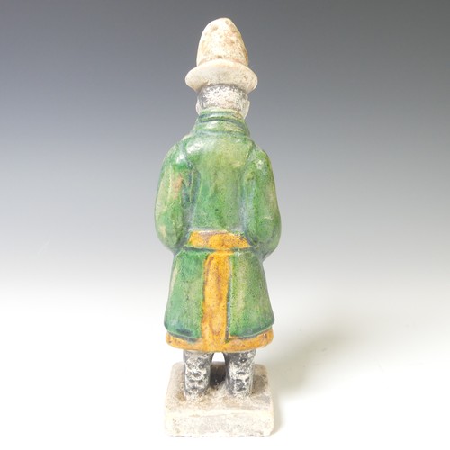 239 - A Chinese Ming dynasty pottery Figure, modelled as a male attendant figure, dressed in a dark green ... 