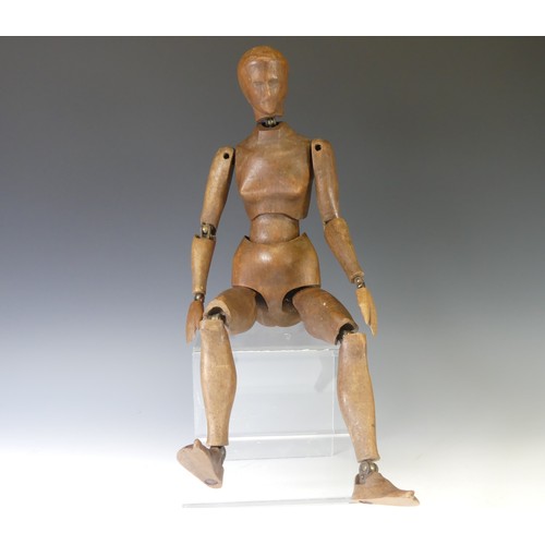 A 19thC French artist's lay figurine carved and stained beech and brass articulated joints,  stamped 'Maquette Francaise sur Armature Articulee, Brevetée S.G.D.G, Paris B Deposee' to the back, H 49 cm.