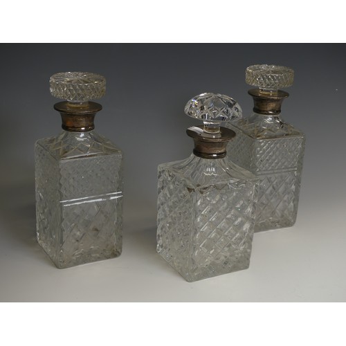 162 - A pair of silver-collared cut glass Decanters, by C J Vander, hallmarked London, 1969, together with... 