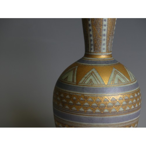 200 - Mary Rich (1940-2022); a studio pottery Bottle Vase, decorated in blue ground with bands of geometri... 