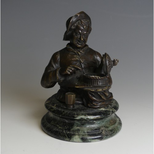 267 - A late 19thC novelty Bronze Desk / Ink Stand, in the form of a jovial man with a bottle under one ar... 