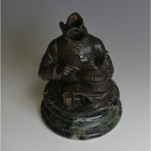 267 - A late 19thC novelty Bronze Desk / Ink Stand, in the form of a jovial man with a bottle under one ar... 