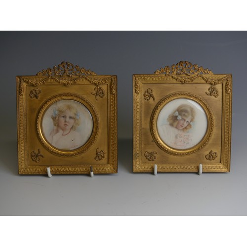 277 - A pair of early 20thC Portrait Miniatures of young girls, watercolour on ivory, indistinctly signed ... 