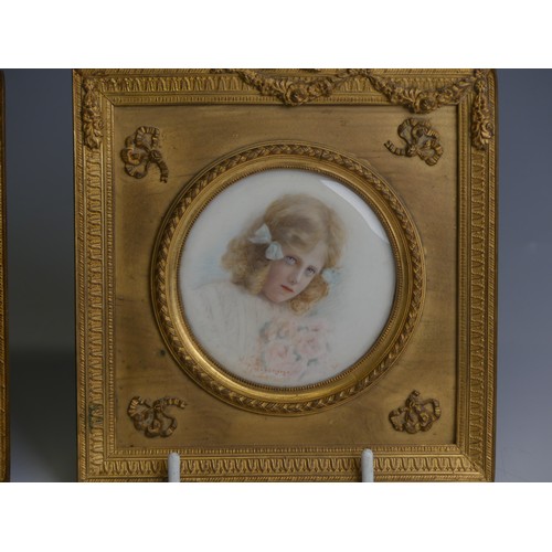 277 - A pair of early 20thC Portrait Miniatures of young girls, watercolour on ivory, indistinctly signed ... 