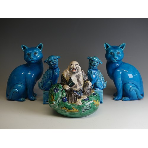 263 - A pair of 20thC Chinese azure blue Dogs of Foo, modelled in upright pose on plinths, H 16cm, togethe... 