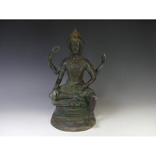 230 - A vintage Thai verdigris Figure, possible Phra Phrom, modelled seated on a plinth with inscription 4... 