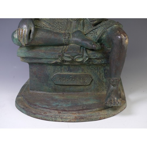 230 - A vintage Thai verdigris Figure, possible Phra Phrom, modelled seated on a plinth with inscription 4... 