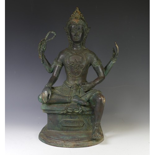 230 - A vintage Thai verdigris Figure, possible Phra Phrom, modelled seated on a plinth with inscription 4... 