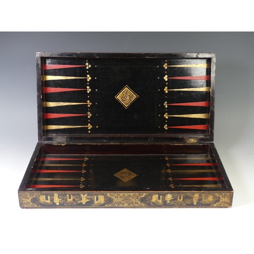 257 - An early 19thC Chinese export lacquer rectangular games box, decorated in gilt with a chess board, t... 