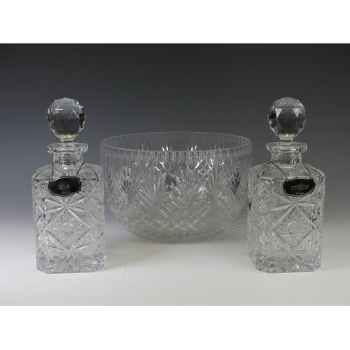 191 - A pair of cut crystal glass Decanters, of rectangular form with star cut decoration, circular stoppe... 