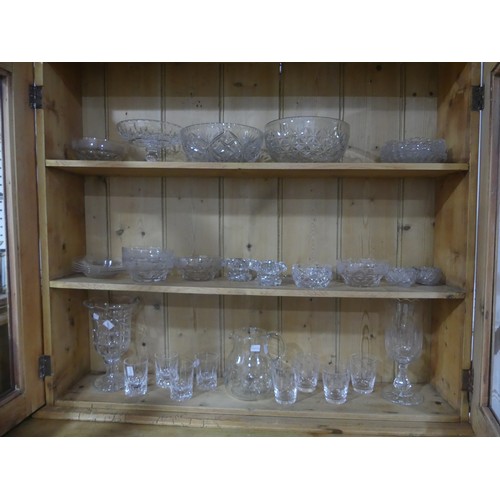 166 - A quantity of cut and moulded Glass, to comprise Vases, Bowls, Dishes, Ashtrays, etc. approximately ... 