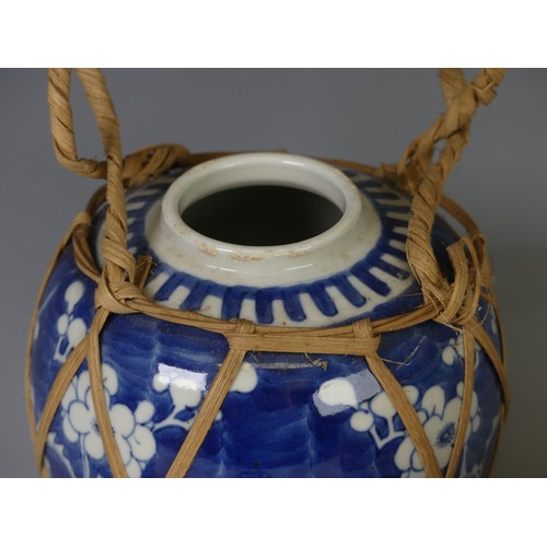 236 - A 20thC Chinese porcelain blue and white Ginger Jar, in prunus pattern with corresponding lid, conce... 