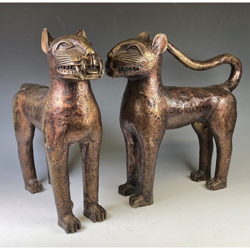 271 - A large pair of African 'Benin' Leopards, patinated resin bronze with engraved circular design, one ... 