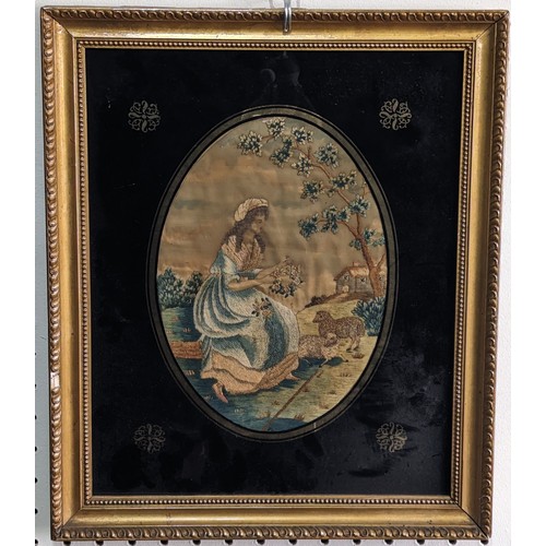 290 - A Georgian embroidered portrait of a Woman, in oval eglomise frame, titled and dated 'Ann Cluer 1800... 