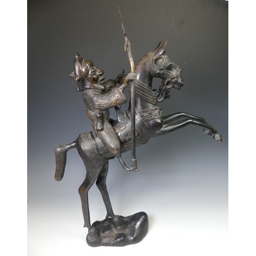 270 - A large West African Benin bronze Statue of a horse and rider, W 49 cm x H 69.5 cm x D 12 cm.... 