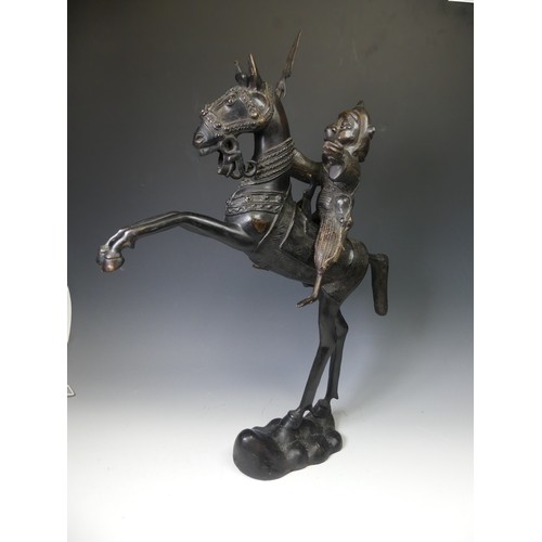 270 - A large West African Benin bronze Statue of a horse and rider, W 49 cm x H 69.5 cm x D 12 cm.... 