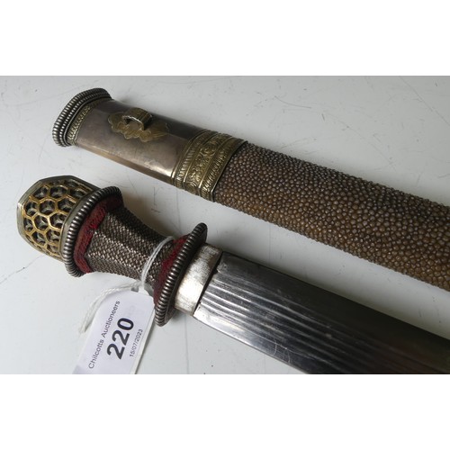 220 - A late 19thC Tibetan / Bhutanese Short Sword, the single edged steel blade with silver wirework grip... 