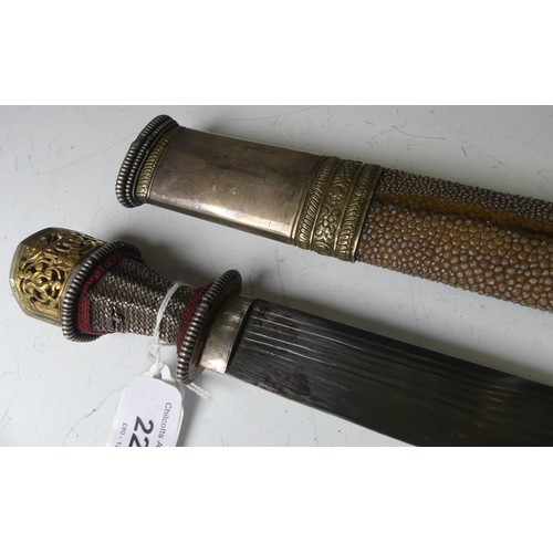 220 - A late 19thC Tibetan / Bhutanese Short Sword, the single edged steel blade with silver wirework grip... 