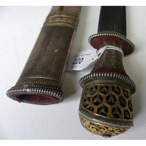 220 - A late 19thC Tibetan / Bhutanese Short Sword, the single edged steel blade with silver wirework grip... 