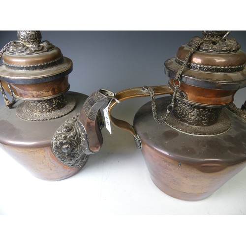 221 - A pair of 19thC Tibetan silver mounted copper ceremonial Teapots, of typical form, the removable dom... 