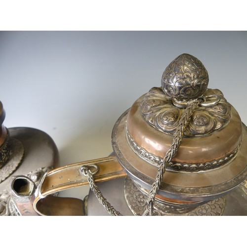 221 - A pair of 19thC Tibetan silver mounted copper ceremonial Teapots, of typical form, the removable dom... 