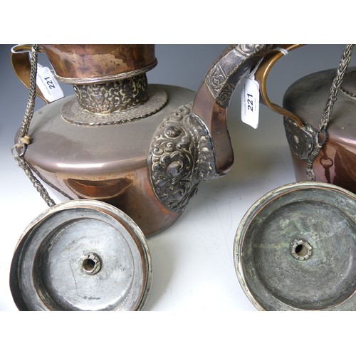 221 - A pair of 19thC Tibetan silver mounted copper ceremonial Teapots, of typical form, the removable dom... 