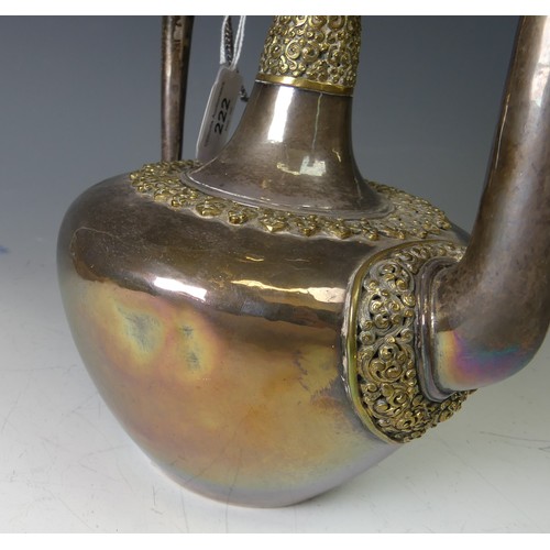 222 - A 19thC Tibetan silver and parcel-gilt ceremonial Teapot / Ewer, the plain tapering circular body wi... 