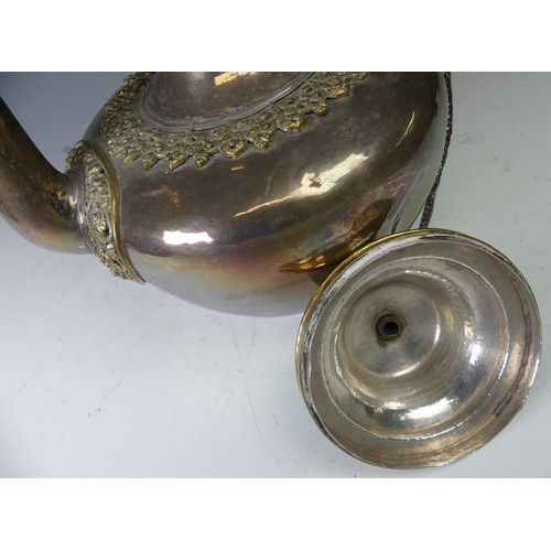 222 - A 19thC Tibetan silver and parcel-gilt ceremonial Teapot / Ewer, the plain tapering circular body wi... 