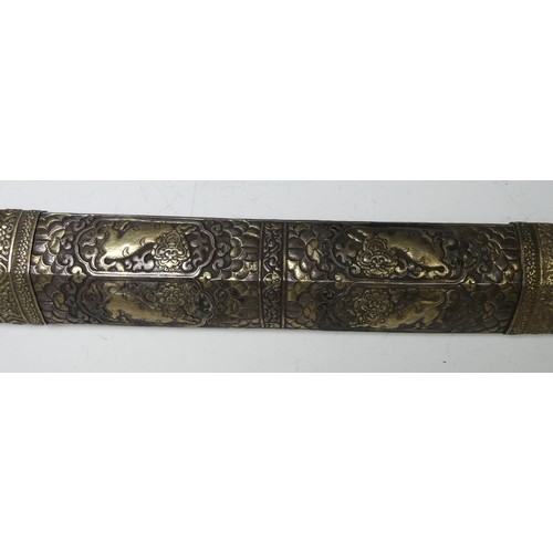 227 - A late 19thC Tibetan / Bhutanese Long Sword, the single edged steel blade with silver wire grip and ... 