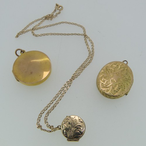 216 - A small 9ct yellow gold circular Locket, the front with foliate engraved decoration, 15mm wide, on a... 