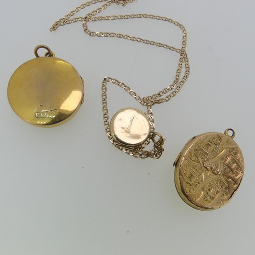 216 - A small 9ct yellow gold circular Locket, the front with foliate engraved decoration, 15mm wide, on a... 