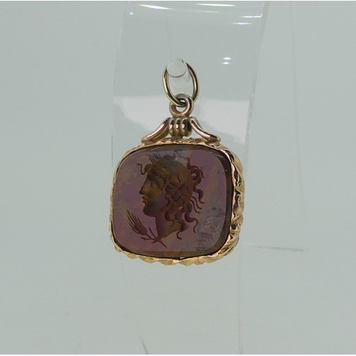 220 - An antique style hardstone intaglio Fob, possibly jasper, carved with a classical head, unmarked yel... 