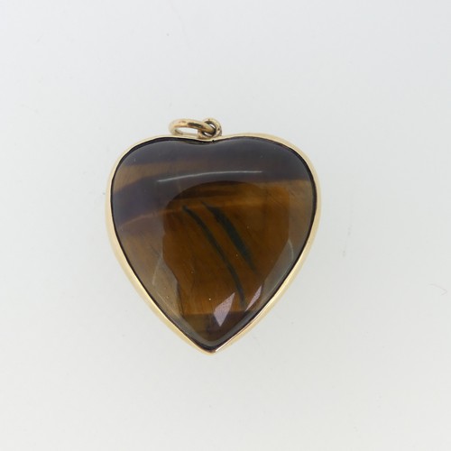 221 - A 9ct gold mounted Tiger's Eye heart shaped Pendant, hallmarked London 1977, 3cm wide.... 