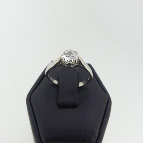 100 - A single stone diamond Ring, the cushion cut stone approx. 0.6ct, claw set in 18ct white gold, Size ... 