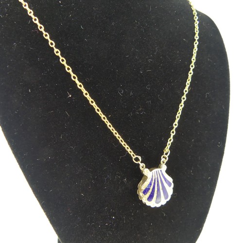 102 - An antique scallop shell memorial Pendant, the front with five rays of blue enamel, the reverse with... 