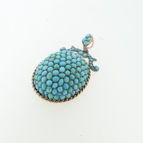 104 - A 19thC turquoise Pendant, of oval form with ropetwist border, scrolling surmount and suspension loo... 