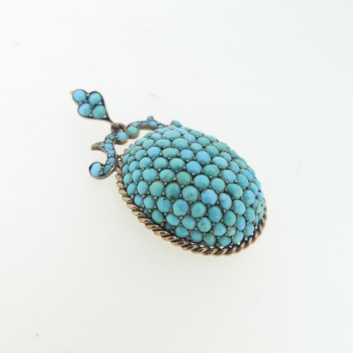 104 - A 19thC turquoise Pendant, of oval form with ropetwist border, scrolling surmount and suspension loo... 