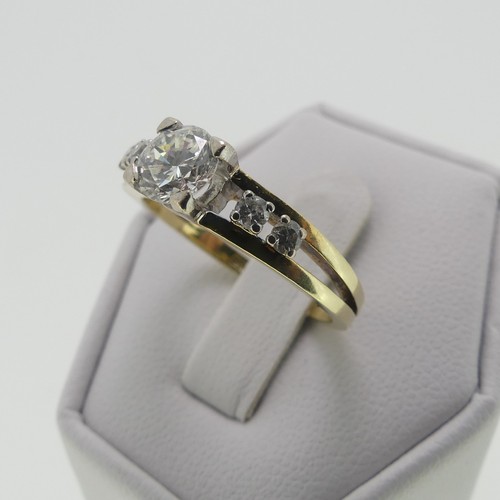 105 - A 14ct gold and diamond Ring, the central brilliant cut stone approx. 0.65ct, four claw set in white... 