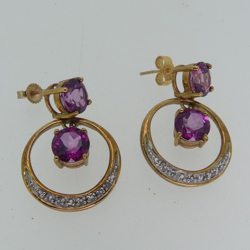 196 - A pair of synthetic pink sapphire Earrings, the 9ct gold open circular drops with claw set sapphire ... 