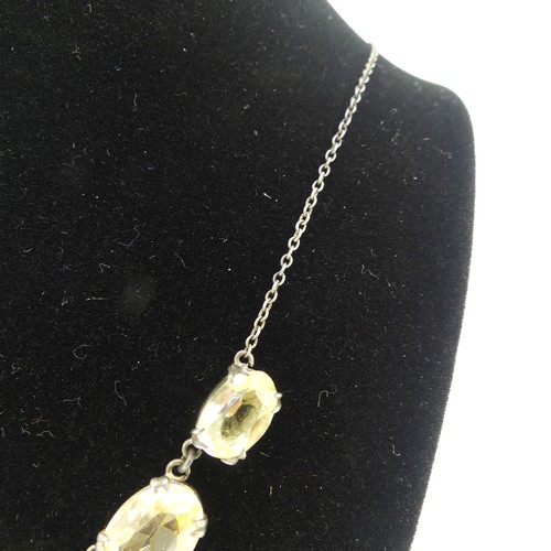 151 - A vintage graduated five stone citrine Necklace, the oval facetted stones claw set on integral silve... 