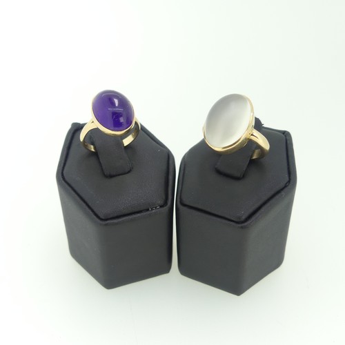 112 - A cabochon amethyst Ring, 15mm long, collet set in 14ct yellow gold, Size N, 4.8g, together with a 9... 