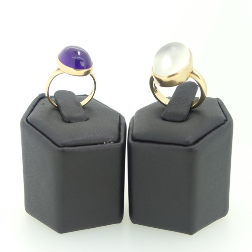 112 - A cabochon amethyst Ring, 15mm long, collet set in 14ct yellow gold, Size N, 4.8g, together with a 9... 