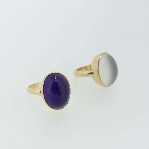 112 - A cabochon amethyst Ring, 15mm long, collet set in 14ct yellow gold, Size N, 4.8g, together with a 9... 