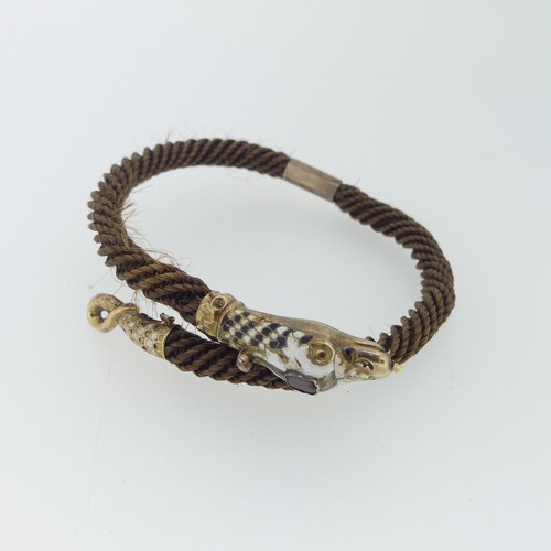 180 - A 19thC snake memorial Bangle, formed of woven hair with enamelled snake head and tail finials, the ... 