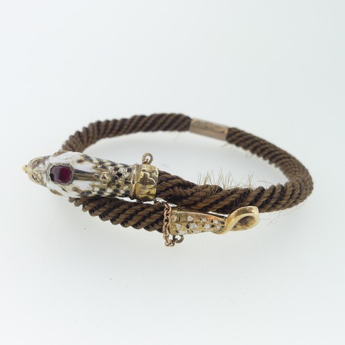 180 - A 19thC snake memorial Bangle, formed of woven hair with enamelled snake head and tail finials, the ... 