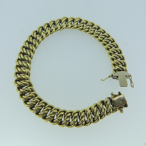 181 - An 18ct yellow gold Bracelet, with integral clasp, 10.2mm wide, 19.5cm long, 25.1g.