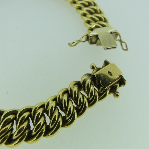 181 - An 18ct yellow gold Bracelet, with integral clasp, 10.2mm wide, 19.5cm long, 25.1g.