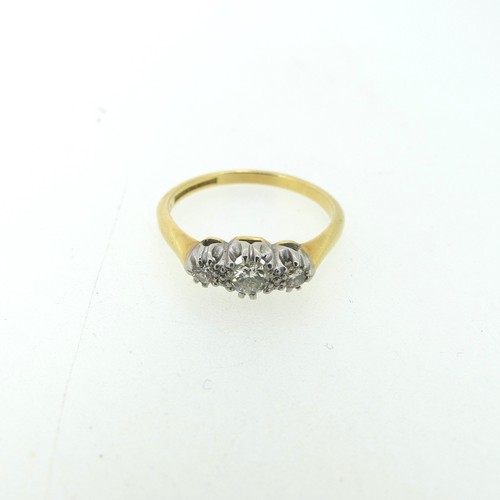 116 - A small three-stone diamond Ring, the centre stone approx. 0.17ct, mounted in 18ct yellow gold and p... 