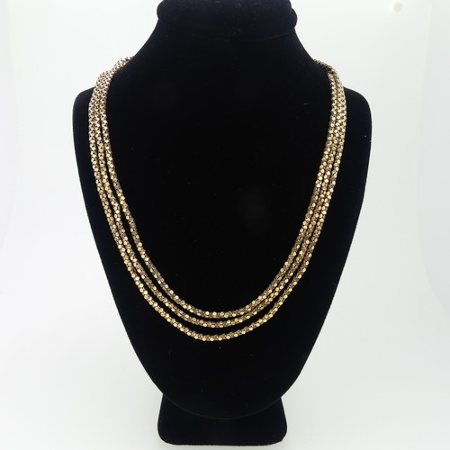 159 - A 9ct gold triple row Necklace, with bolt ring clasp, 54cm long, 15.6g.